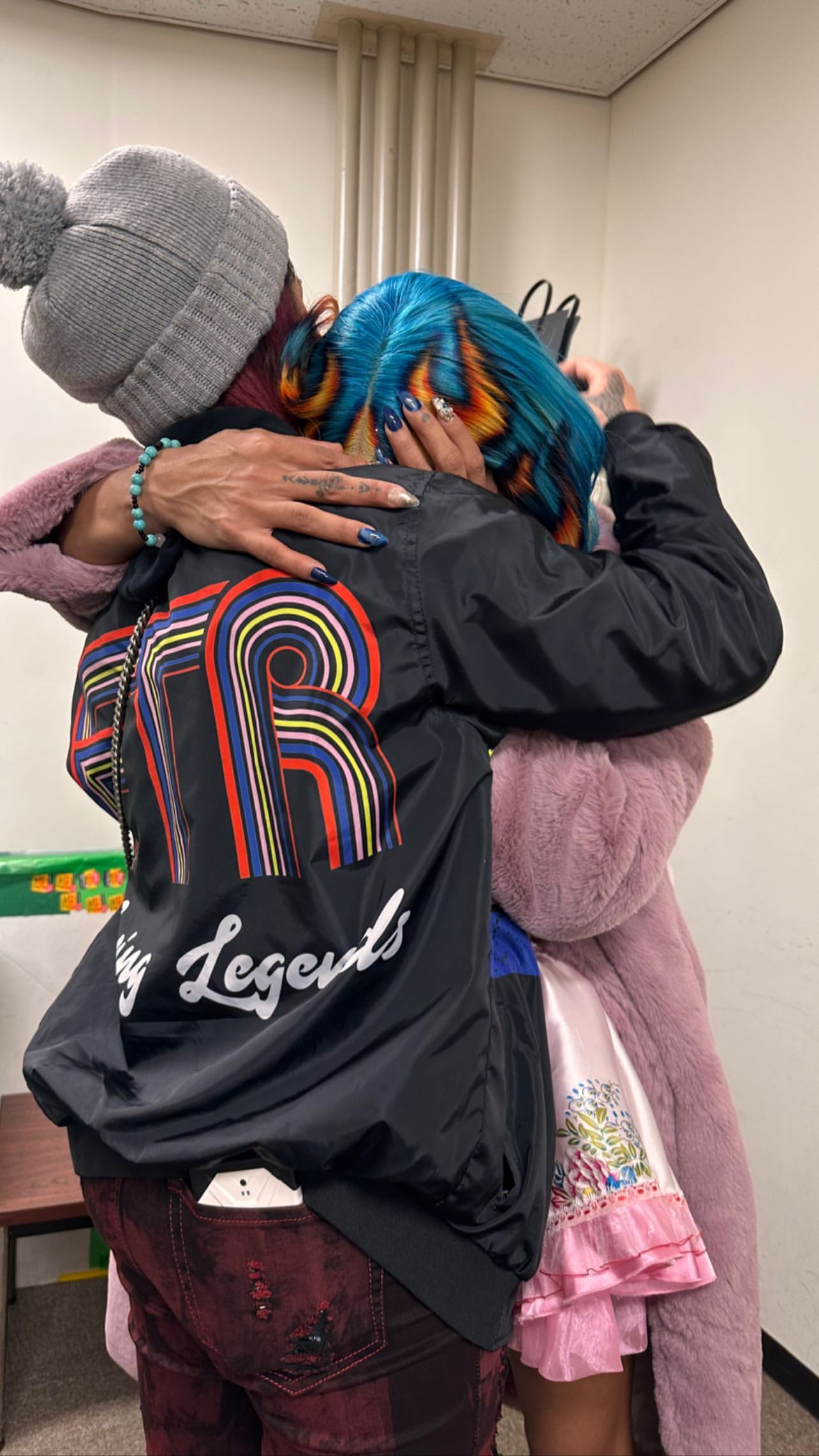 Bayley hugs Mercedes Moné